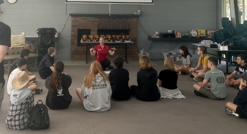 Notebook resting on wooden desk surface